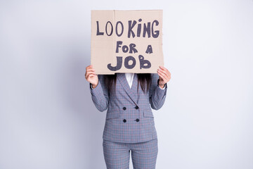 Fototapeta na wymiar Photo of fired lady hold carton placard seek job hiding sad upset face stressed need money for living have two children search any offer formalwear plaid suit isolated grey color background