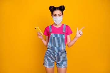 Portrait of her she nice girl using cell wearing safety mask demonstrating mers cov infection copy...