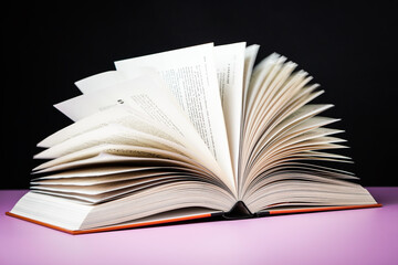 Open book on the table. It is time for education and therefore you need to go back to school.