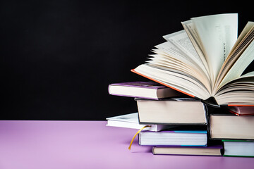 Open book on the table. It is time for education and therefore you need to go back to school.