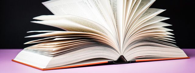 Banner open book on the table. It is time for education and therefore you need to go back to school.