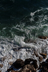 Ocean wave background breaking sea water rocky shore