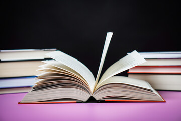 Open book on the table. It is time for education and therefore you need to go back to school.