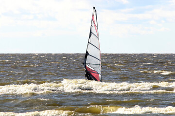 Fototapeta premium Windsurfing sport at sea waves