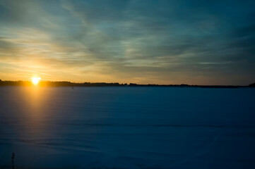 Fototapeta na wymiar Finland : Sunset On The Snow In The Suburbs Of Finland