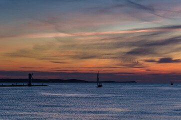 Fototapeta na wymiar YACHT AT SUNSET - Evening silence by the calm sea