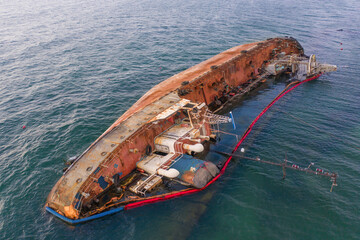 Tanker after the accident, overturned in the water.