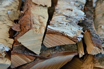 Close up of cleaved birch firewood, dried up and ready for the wood stove.