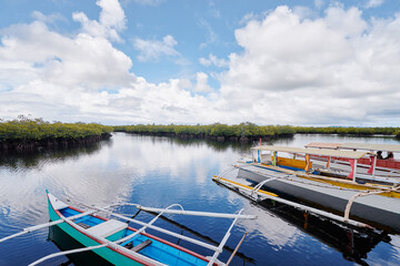 Beautiful landscape with traditional fishing boatss in mangrove lagoon, Siargao Island, Philippines.