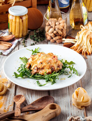 Julienne under the cheese with arugula 