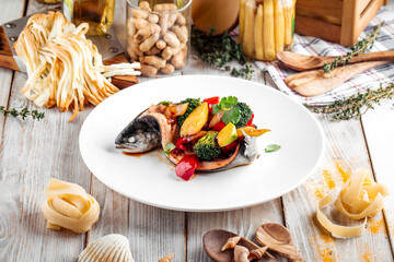 Gourmet sea bass fish filled with vegetables