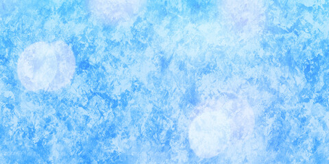 Abstract blue background with flecks of sunlight. Christmas and winter background.