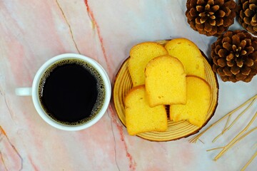 Crispy butter and sugar toasts served with hot black coffee.