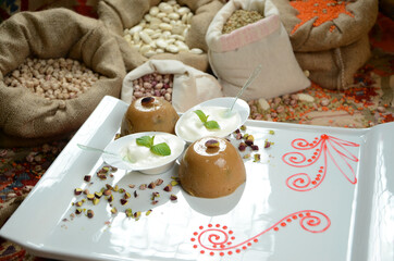 turkish traditional dessert in front of legume family sacks