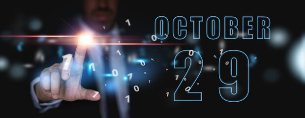 october 29th. Day 29 of month, announcement of date of business meeting or event. businessman holds the name of the month and day on his hand. autumn month, day of the year concept