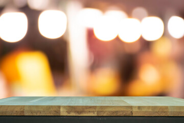 Product display on brown wooden table Bokeh background from the bulb shop