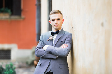 Headshot portrait of young man smiling isolated on outside outdoors background