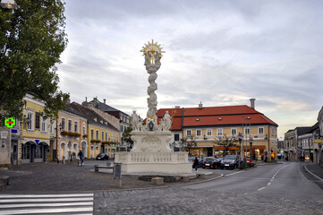 Fototapeta na wymiar Marian and Holy Trinity column or The Plague Column (German: Pestsäule) in Mödling - a town and capital of the Austrian district of the same name located approximately 14 km south of Vienna.