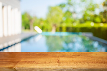 Product show On a brown wooden table Outdoor swimming pool area