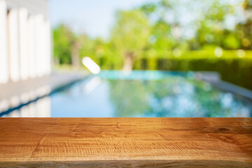 Product show On a brown wooden table Outdoor swimming pool area