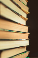 Stack of books, close-up, selective focus.