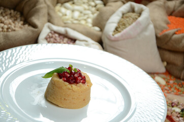 turkish traditional dessert in front of legume family sacks