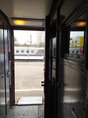 View of the platform from the passenger train vestibule