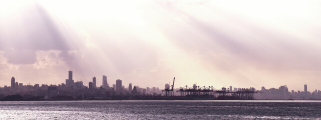 Beirut city skyline with shipping harbor cranes  in foreground