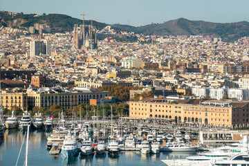 Cityscape of Barcelona with the port. Aerial view from the cable car that connects La Barceloneta beach to Montjuic hill. Catalonia, Spain