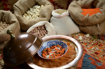 traditional turkish ottoman food in front of legume family sacks