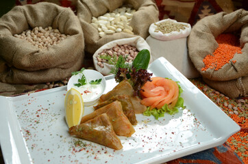turkish traditional dessert in front of legume family sacks