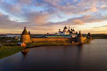 Fototapeta na wymiar old Solovetsky fortress view from the lake at dawn filmed from a drone