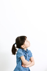 girl thinking with folded arms on white background