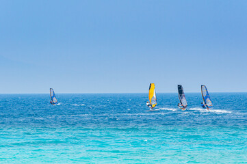 Lefkada, Greece. August 18th, 2011. Some people windsurf in the bay of Agios Ioannis in Lefkada,...