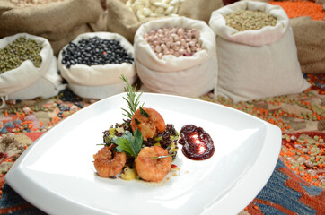 traditional dessert in front of legume family sacks