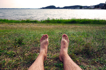 Summer vacation on the grassy beach by the water reservoir