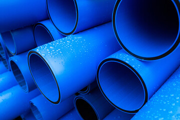 Plastic pipe is stockpiled for storage in the open air