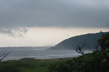 storm clouds over the sea and hills