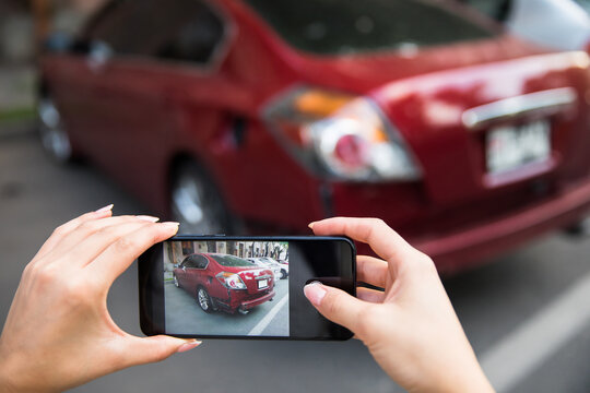 hand smartphone and take photo car crash