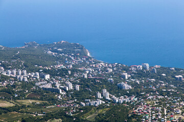 Panoramic view from Mount Ai-Petri to the Black Sea. Below the village of Alupka Big Yalta. Selective focus. Crimea.