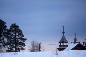 wooden church in Finland / winter landscape in Scandinavia view of the wooden church, old architecture