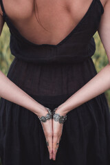 The girl's hands behind her back