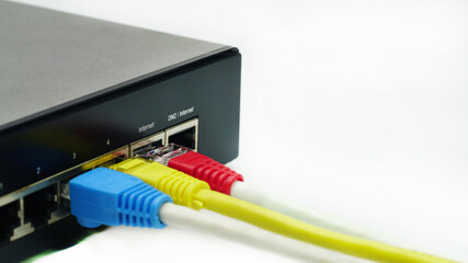 LAN network and internet connection, Ethernet RJ45 cable plug to lan port,modem router.Red, Yellow,...