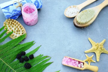 Flat lay with scrub, peeling and body care items