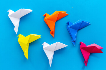 Paper pigeons in origami technique. DIY creativity. View from above