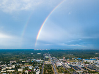 Fototapeta na wymiar Double rainbow over a residential area of Kiev. Aerial drone view.
