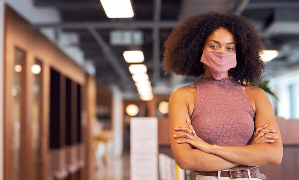 Portrait of African businesswoman wearing face mask in office