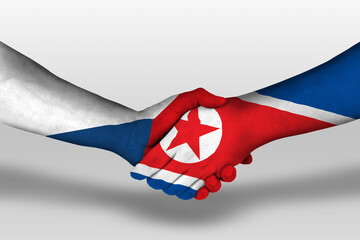 Handshake between north korea and czech republic flags painted on hands, illustration with clipping path.