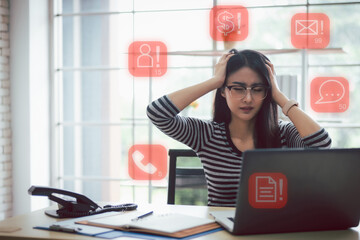 Asian business woman feeling stress from work. Social media notification icons.