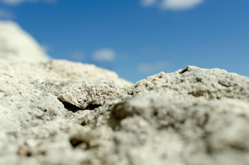 Summer sunny day on the rock beach.Empty space for design